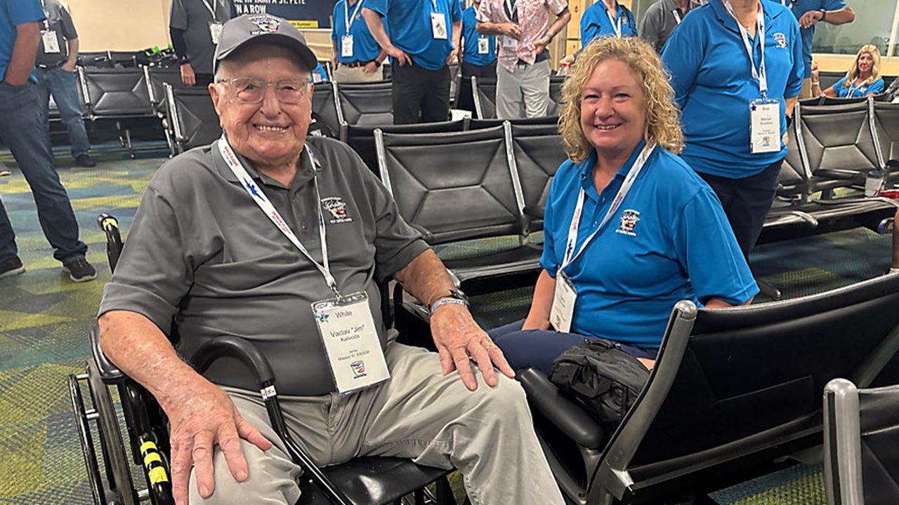 Jim Kalivoda and his daughter, Lynn, prepare to take off on Honor Flight of West Central Florida's Mission 57 (Angie Angers).