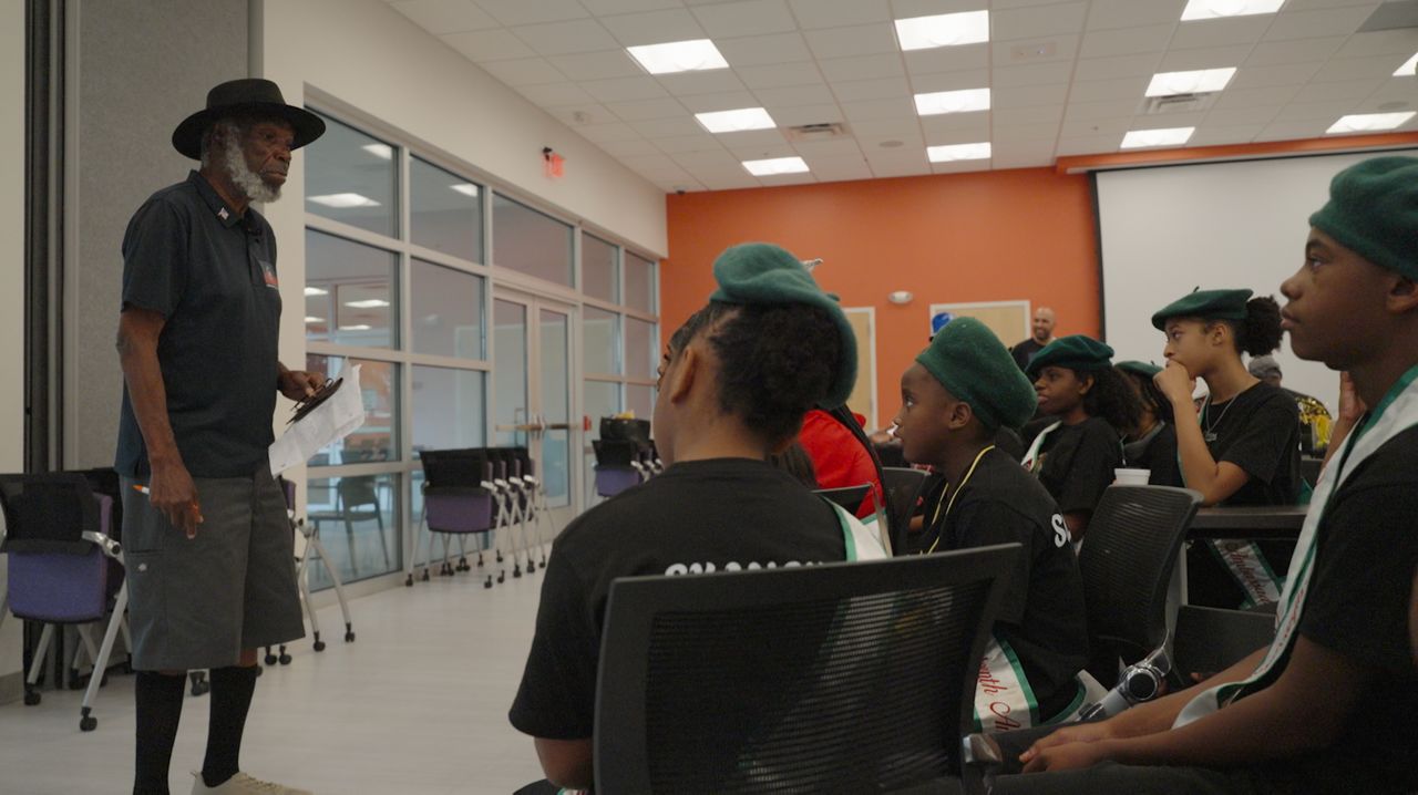 Juneteenth flag creator Ben Haith talking to students (Spectrum News)