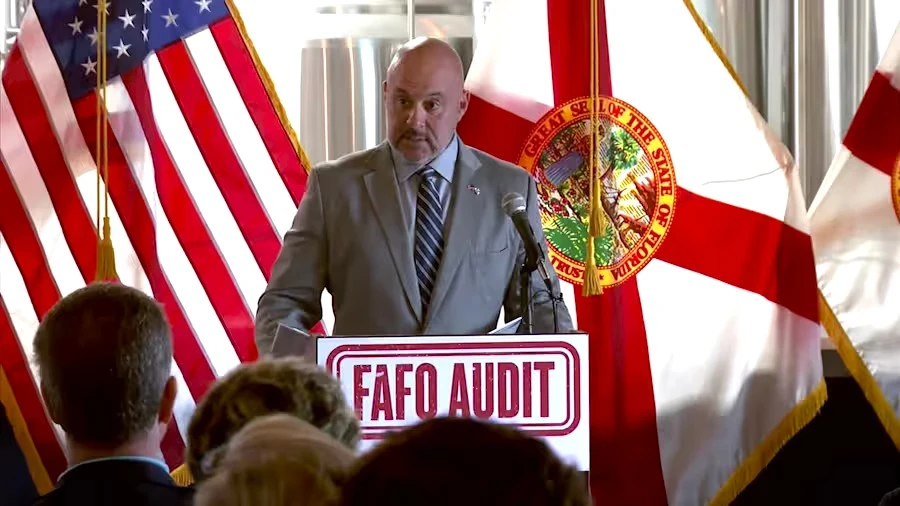 Florida CFO Blaise Ingoglia speaks at a lectern in Jacksonville Beach.