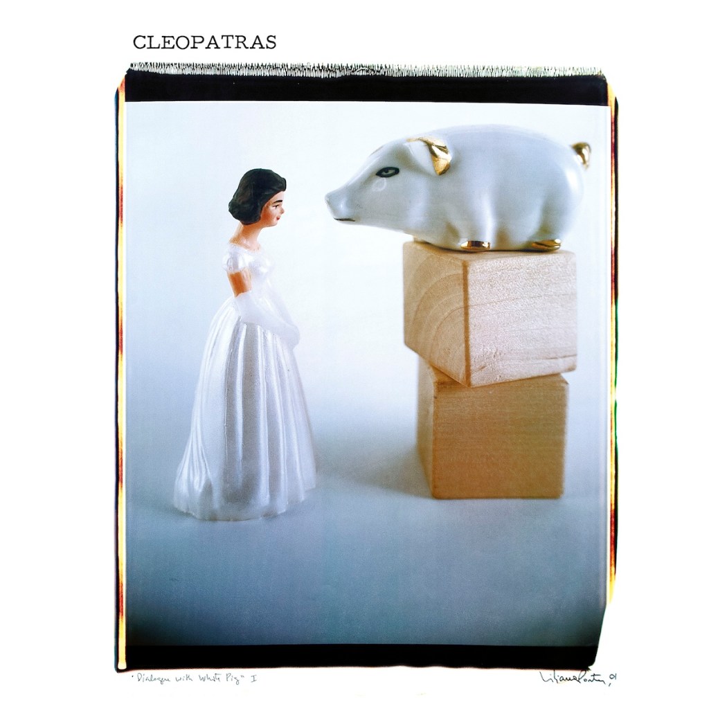 Photo of two porcelain figurines.  