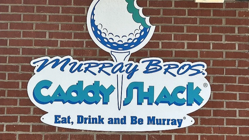 The Caddyshack logo on the side of the building.