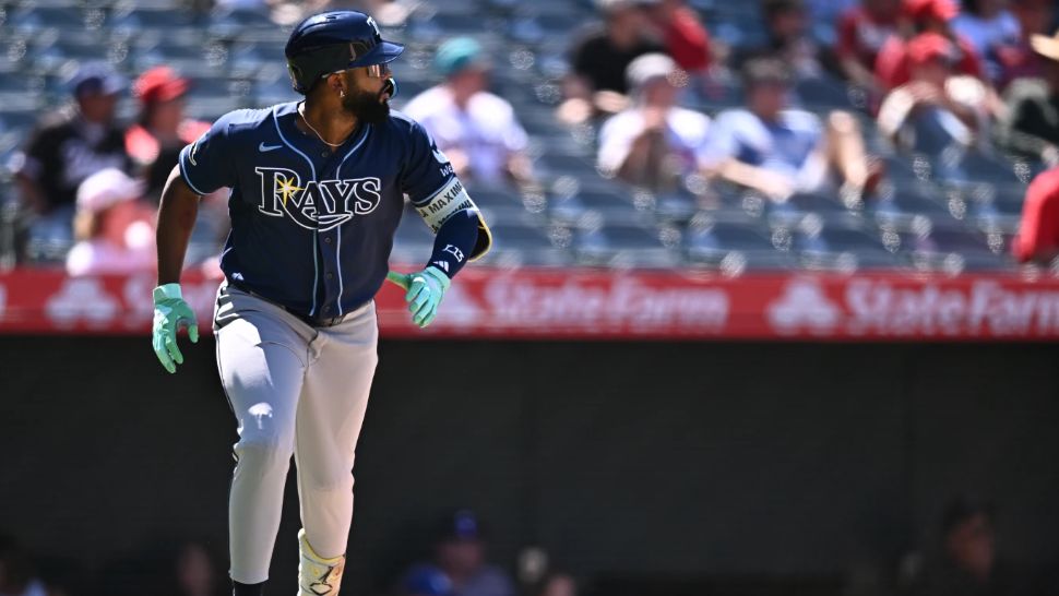 Tampa Bay Rays' Junior Caminero watches his home run during the eighth inning of a baseball game against the Los Angeles Angels, Sunday, June 14, 2026, in Anaheim, Calif. (AP Photo/William Liang)