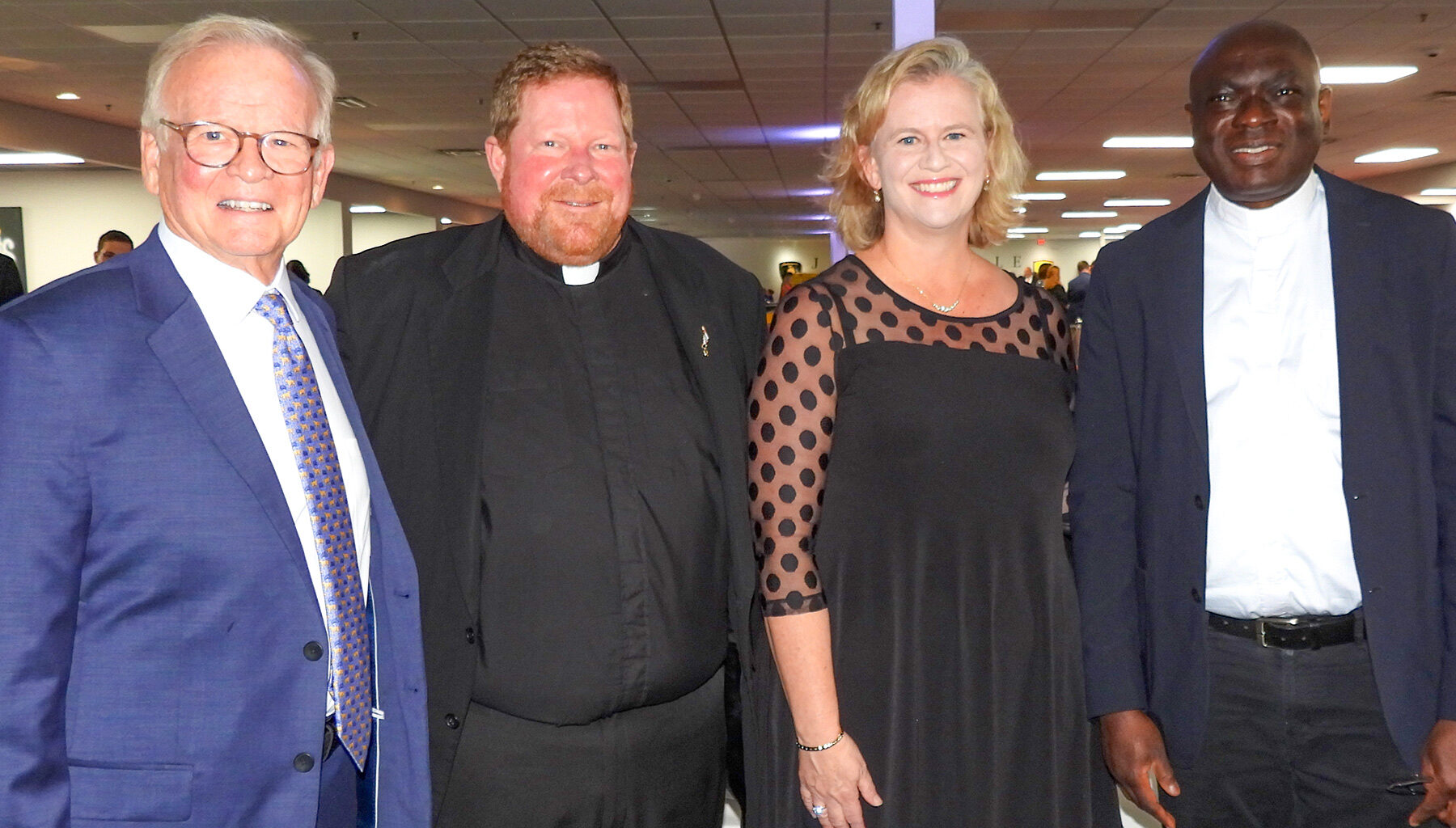 Jerry Weedon with Father Jason Trull, Lauren Weedon and Father Sebastian Musa
