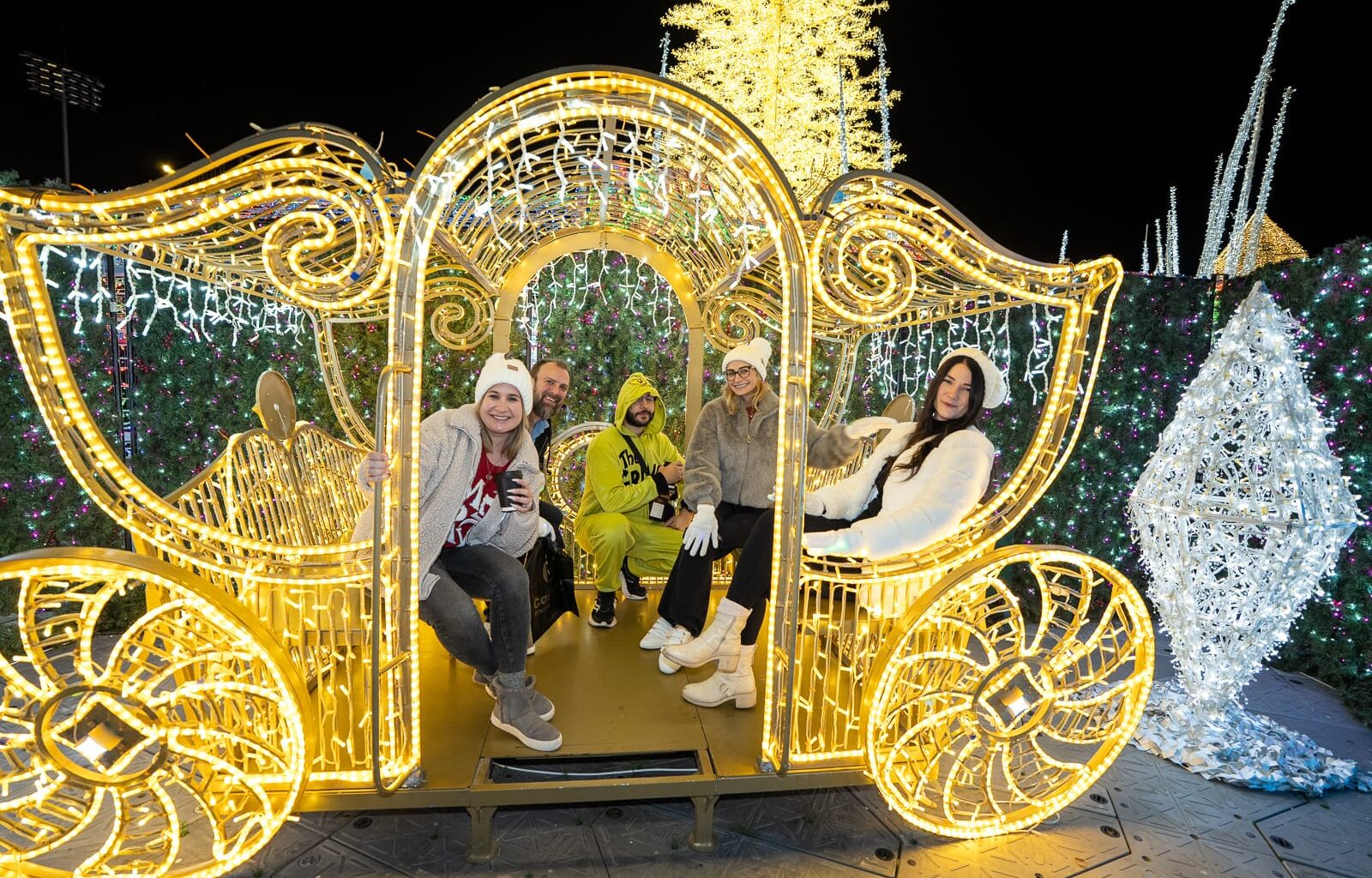 Enchant Christmas in St. Pete featuring a carriage made of lights