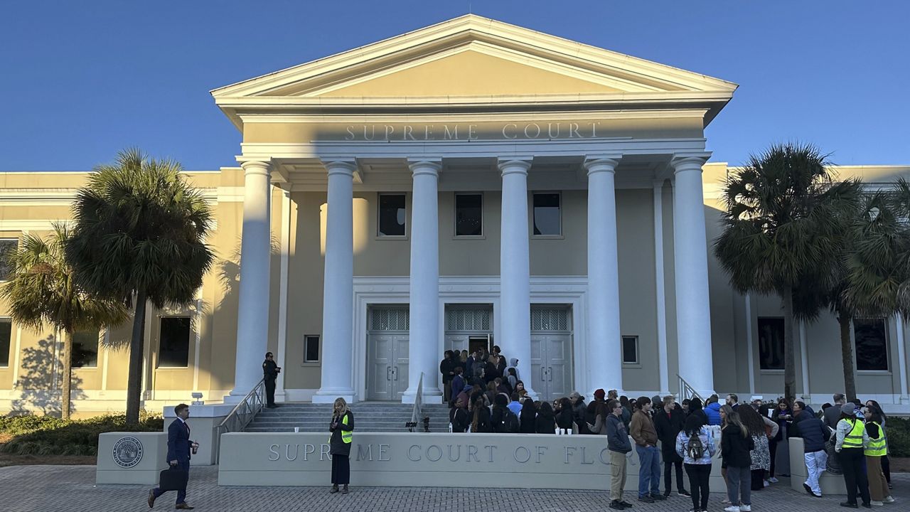 FILE - People gather outside the Florida Supreme Court, Feb. 7, 2024, in Tallahassee, Fla. (AP Photo/Brendan Farrington, File)