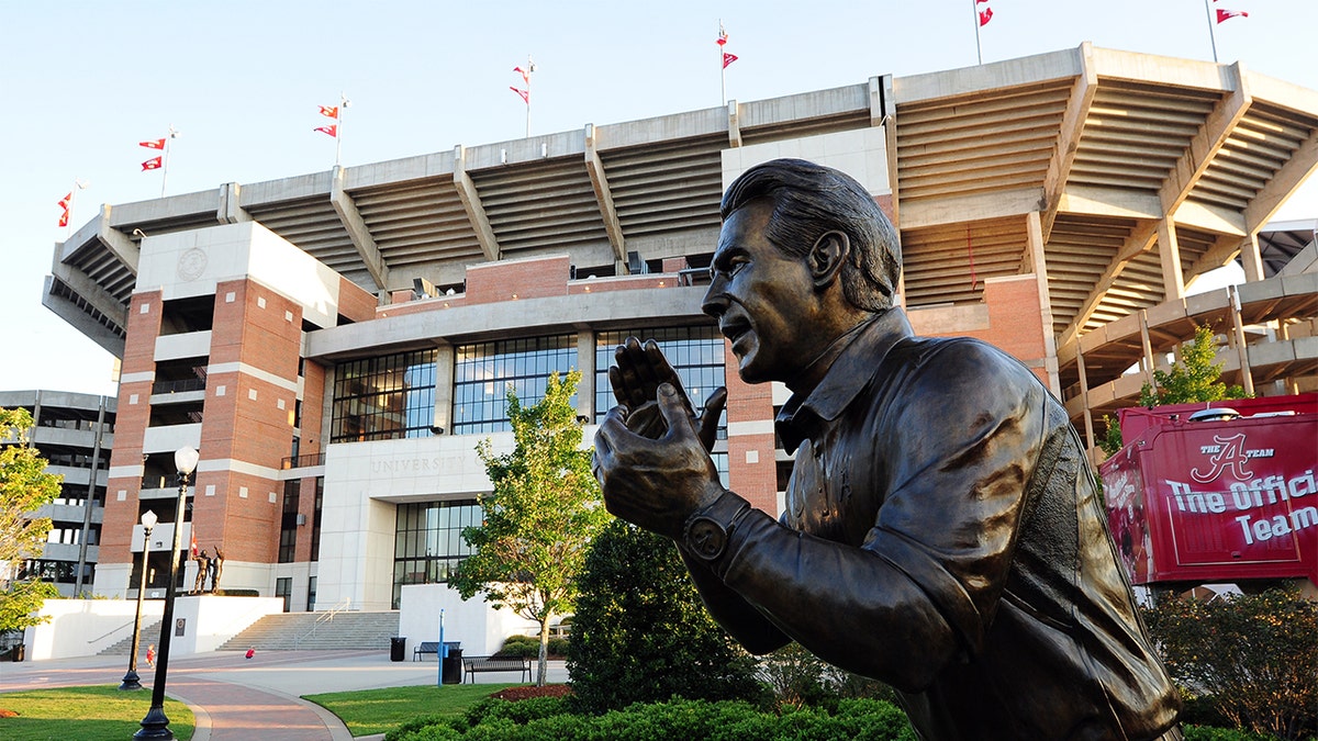 Nick Saban statue standing outside Bryant-Denny Stadium at University of Alabama campus