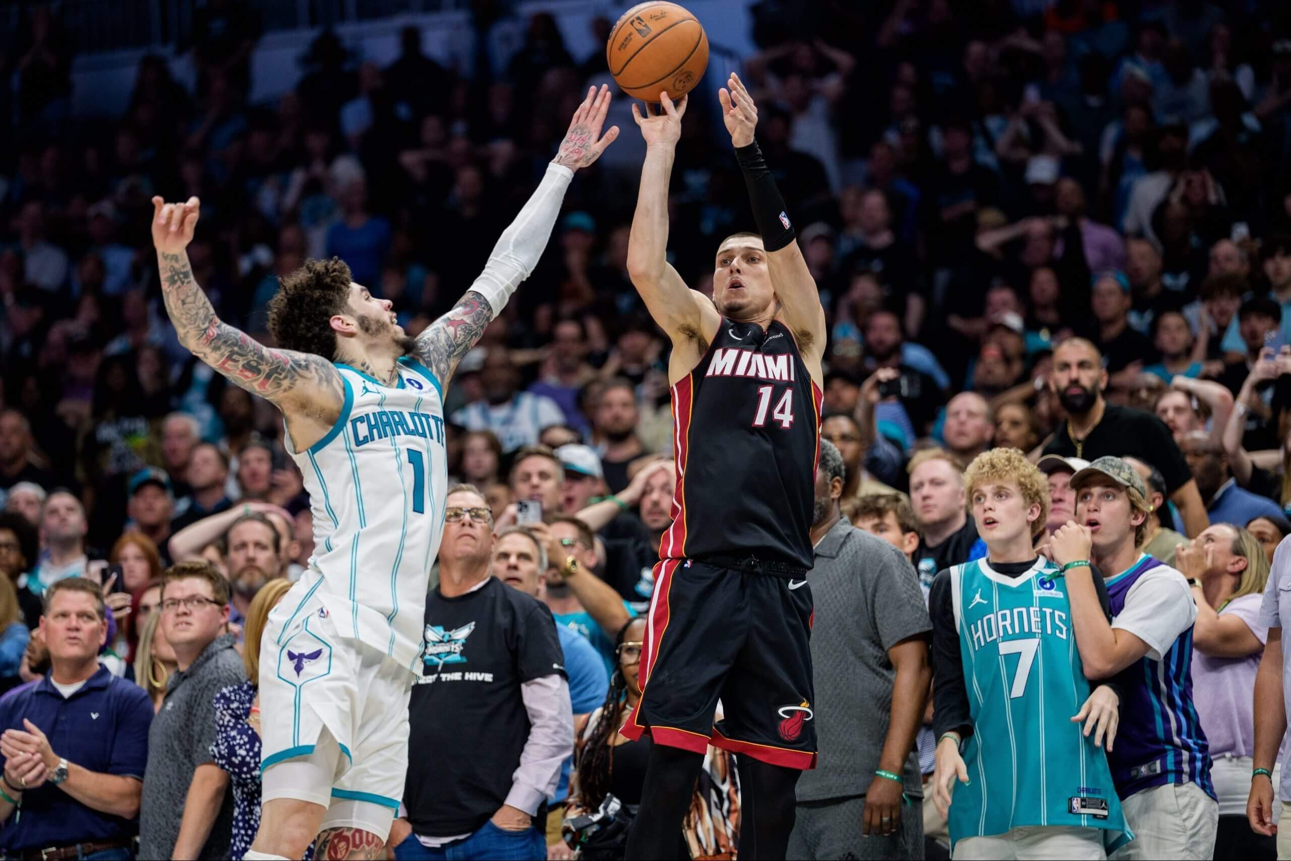 Tyler Herro shoots over LaMelo Ball.