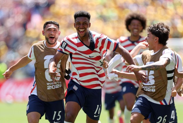 Alex Freeman, #16 of the United States, celebrates with teammates after scoring his team's second goal during the FIFA World Cup 2026 Group D match between USA and Australia at Seattle Stadium on June 19 in Seattle, Washington. (Jamie Squire/Getty Images)