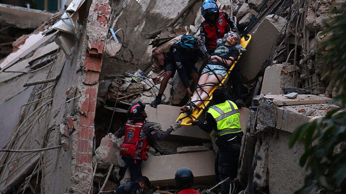 Rescue workers carry a person on a stretcher out of a collapsed building following an earthquake in Caracas on June 24, 2026. Rescue workers carry a person on a stretcher out of a collapsed building following an earthquake in Caracas on June 24, 2026.