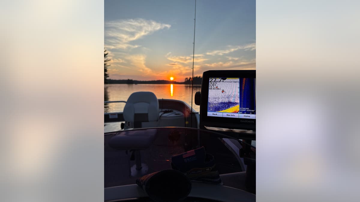 sunsets on a lake, view from a fishing boat