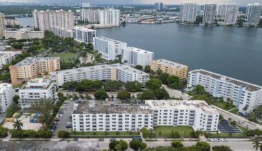 Which Miami-Dade municipalities have seen condo values fall?