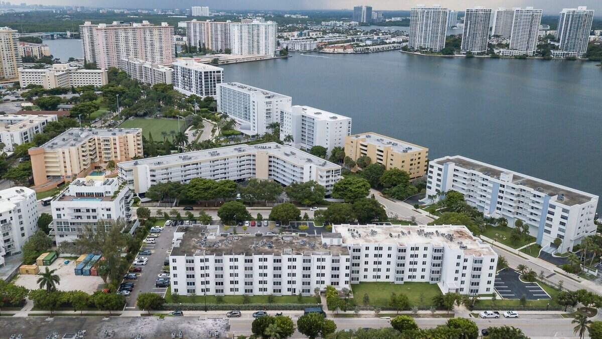 Which Miami-Dade municipalities have seen condo values fall?