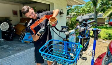 E-Mobilize Mobile Bike Service owner Jake McFadden repairs a customer's electric bicycle at her Palm Harbor home. (Spectrum News/Josh Rojas)