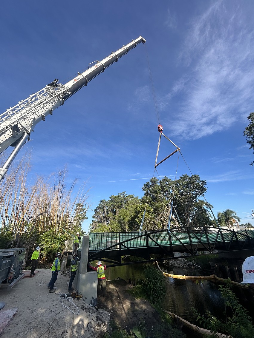 The new Ward Trail pedestrian bridge was delivered Monday, June 15. The bridge is large enough to allow two golf carts on the bridge simultaneously. The new Ward Trail pedestrian bridge was delivered Monday, June 15. The bridge is large enough to allow two golf carts on the bridge simultaneously.