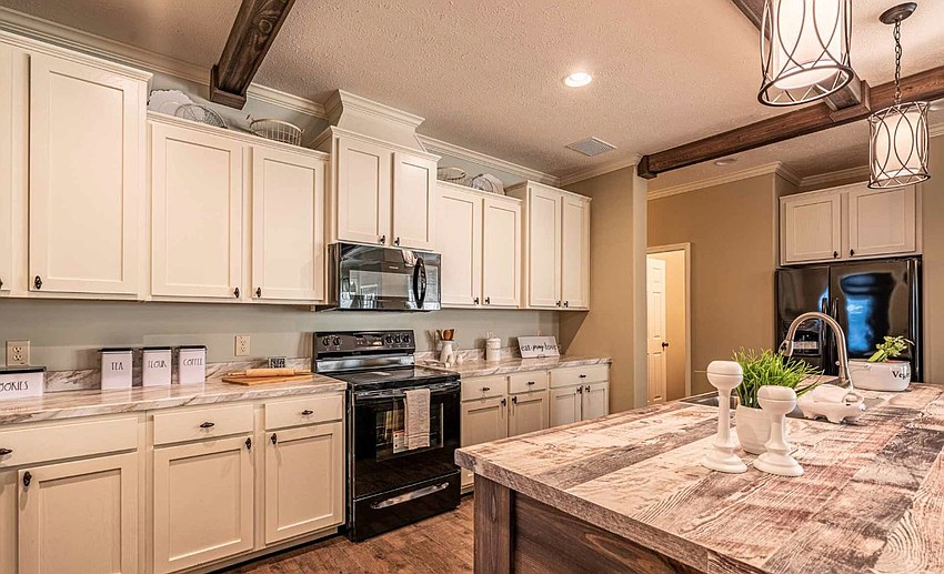The kitchen of a manufactured home like those planned for the city’s affordable housing pilot. The homes are targeted to buyers at 80% to 120% of area median income. Officials from the city of Jacksonville and the U.S. Department of Housing and Urban Development announced a pilot project to increase affordable housing and offer opportunities for homebuying in Jacksonville through sales of manufactured homes.