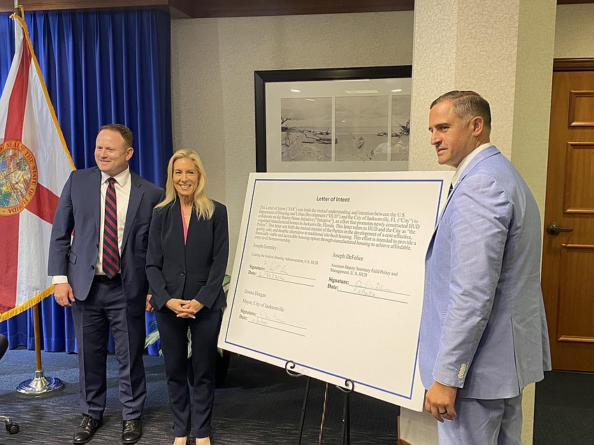 From left: Paul Olin, acting general deputy assistant secretary of the Federal Housing Administration; Jacksonville Mayor Donna Deegan; and Joseph DeFelice, HUD assistant deputy secretary for Field Policy and Management, after ceremonially signing an agreement June 30 to partner on a manufactured home affordable housing pilot in Northwest Jacksonville. From left: Paul Olin, acting general deputy assistant secretary of the Federal Housing Administration; Jacksonville Mayor Donna Deegan; and Joseph DeFelice, HUD assistant deputy secretary for Field Policy and Management, after ceremonially signing an agreement June 30 to partner on a manufactured home affordable housing pilot in Northwest Jacksonville.