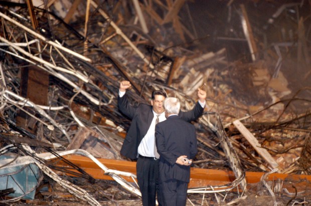 Developer Cameron Kuhn celebrates as demolition occurs on the Jaymont Block in downtown Orlando on Monday, December 8, 2003. (Joe Kaleita/Orlando Sentinel)