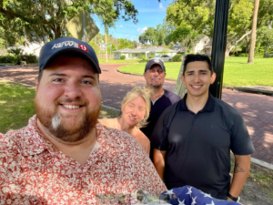 four people posing for a photo