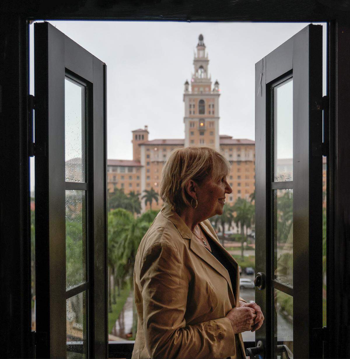Rev. Laurie Hafner, the pastor of Coral Gables Congregational church, has found creative ways to address contemporary issues, the challenges of faith, and the building of community. Pastor Hafner is photographed in the tower where she stays to raise awareness and food for the hungry at Coral Gables Congregational on Wednesday, June 12, 2024, in Coral Gables, Florida.