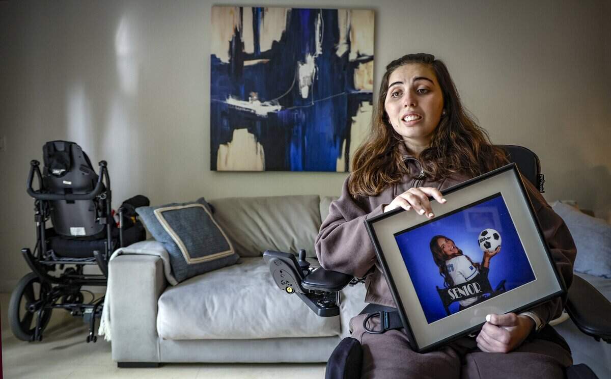 Katerina “Katy” Puig holds an Our Lady of Lourdes Academy senior-year portrait at her home in Miami on Wednesday, Oct. 15, 2025. Puig is still recovering from catastrophic injuries she received in a Biscayne Bay boat crash.