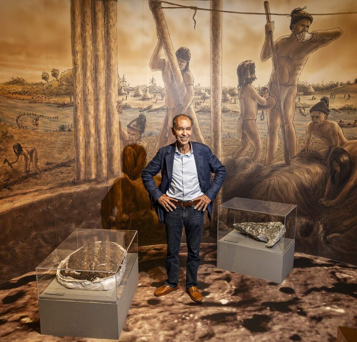 Paul George, resident historian at the Museum of Miami, stands at an exhibit that depicts the 2,000-year-old Miami Circle, the foundation of a Tequesta Indian ceremonial building, and the indigenous inhabitants of the extensive village at the mouth of the Miami River that surrounded it. A sea turtle shell and artifacts recovered from the site are also on exhibit.