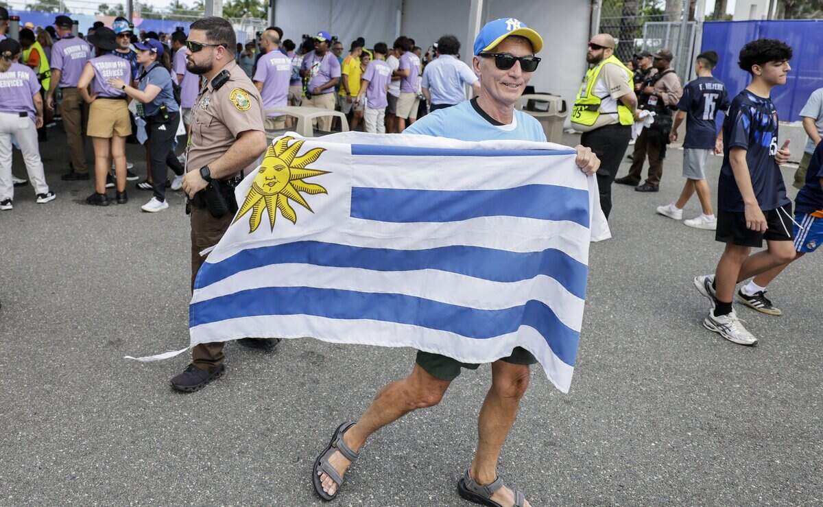 Soccer fans navigate pass security personnel as they enter the gates for Uruguay against Saudi Arabia FIFA World Cup opening match at Miami Stadium on Monday, June 15, 2026.