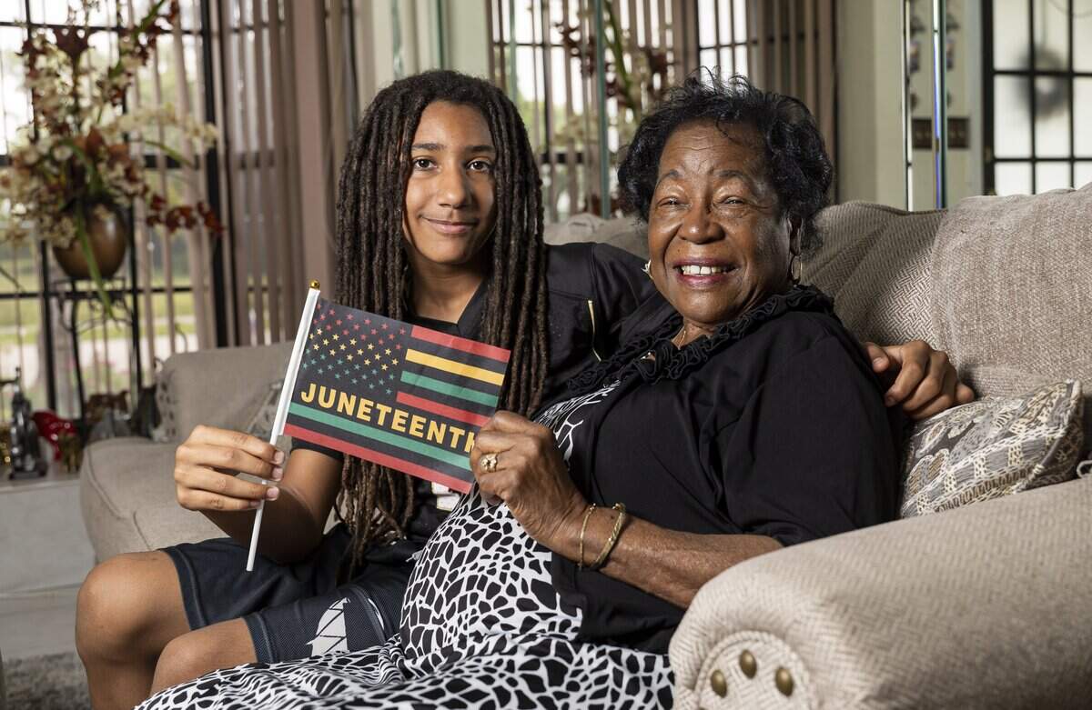Barbara Williamson, 85, and her grandson, Dominiq Williamson, 11, hold a Juneteenth flag at their home on Thursday, June 18, 2026, in Fort Lauderdale, Fla. Williamson participated in sit-ins and fought for passage of the Voting Rights Act of 1965.