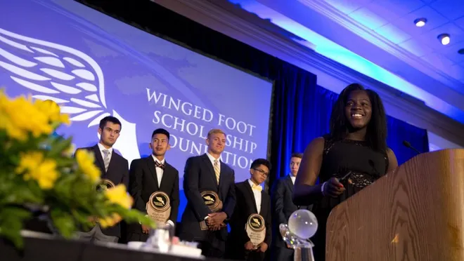 Winner of the 2016 Winged Foot Scholar-Athlete Award Stephanie Paul, center, smiles while giving her acceptance speech Thursday at the Naples Grande Beach Resort in Naples. Paul finished with a 3.62 GPA, lettered in basketball and track, and will be playing Division I basketball for the University of Georgia.
