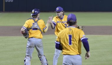 West Chester pitcher Kyle Lazer (center), who pitched a complete game, is congratulated by catcher Caleb Strawhecker (left) after the final out against Tampa on Friday in Cary, N.C.