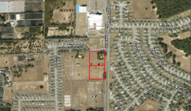 An aerial map from city planning documents outlines the 5.12-acre site at 4410 and 4420 Chandler Road (outlined in red), where an applicant is seeking a future land-use change and rezoning to allow development of the proposed Joy Child Academy child care facility.