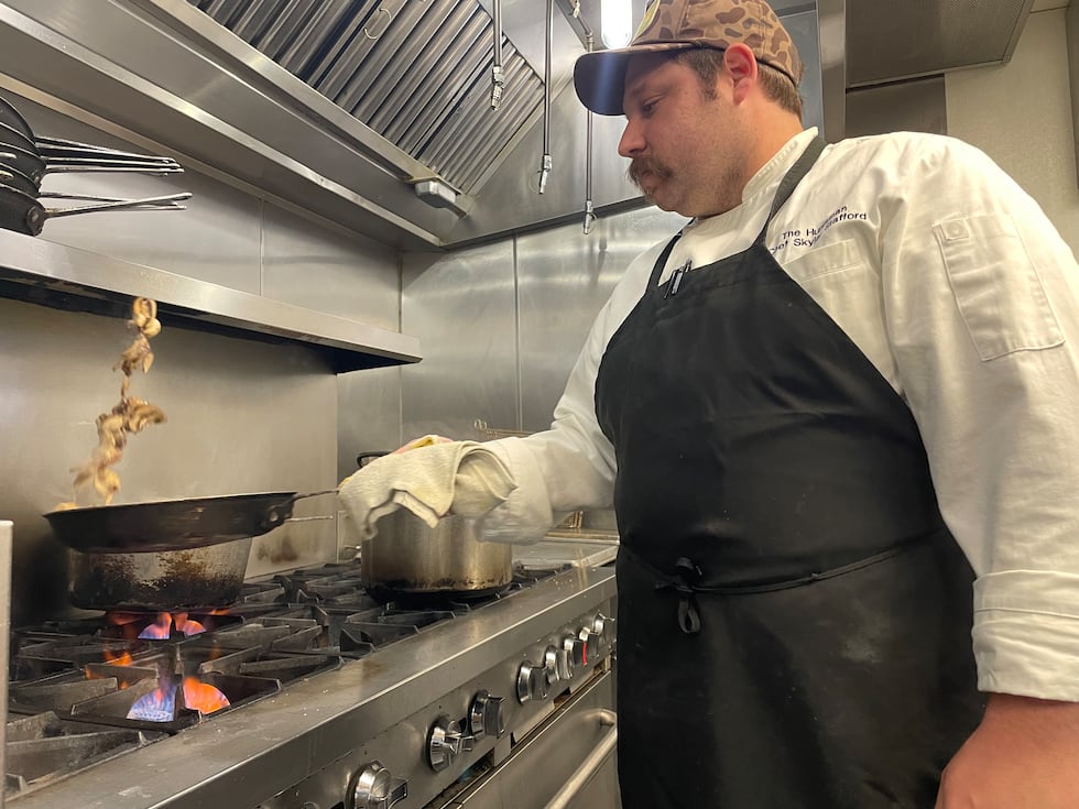 Executive Chef and Co-Owner of The Huntsman, Skylar Stafford, prepares ahead of restaurant...