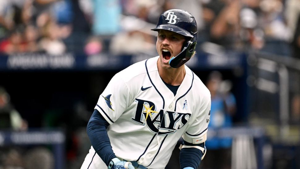 Tampa Bay Rays' Jonny DeLuca celebrates after his two-run home run as he rounds the bases during the seventh inning of a baseball game against the Washington Nationals, Sunday, June 21, 2026, in St. Petersburg, Fla. (AP Photo/Jason Behnken)