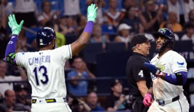 Tampa Bay Rays' Junior Caminero (13) and Yandy Díaz celebrate after Diaz scores on a double by Jonathan Aranda, not pictured, during the seventh inning of a baseball game against the Arizona Diamondbacks Friday, June 26, 2026, in St. Petersburg, Fla. (AP Photo/Jason Behnken)
