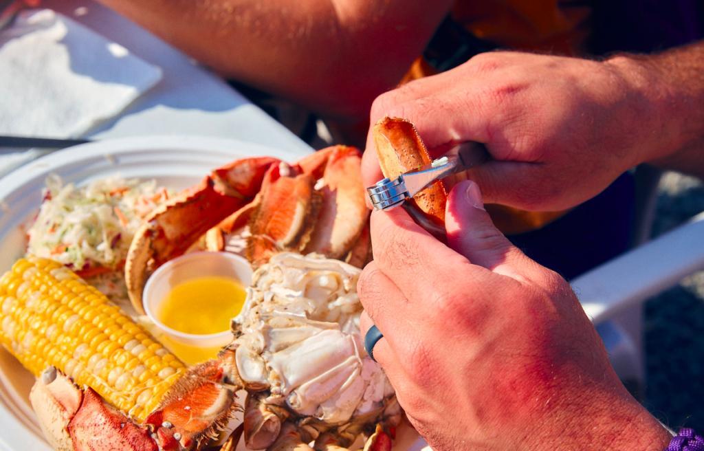 someone opening a crab leg