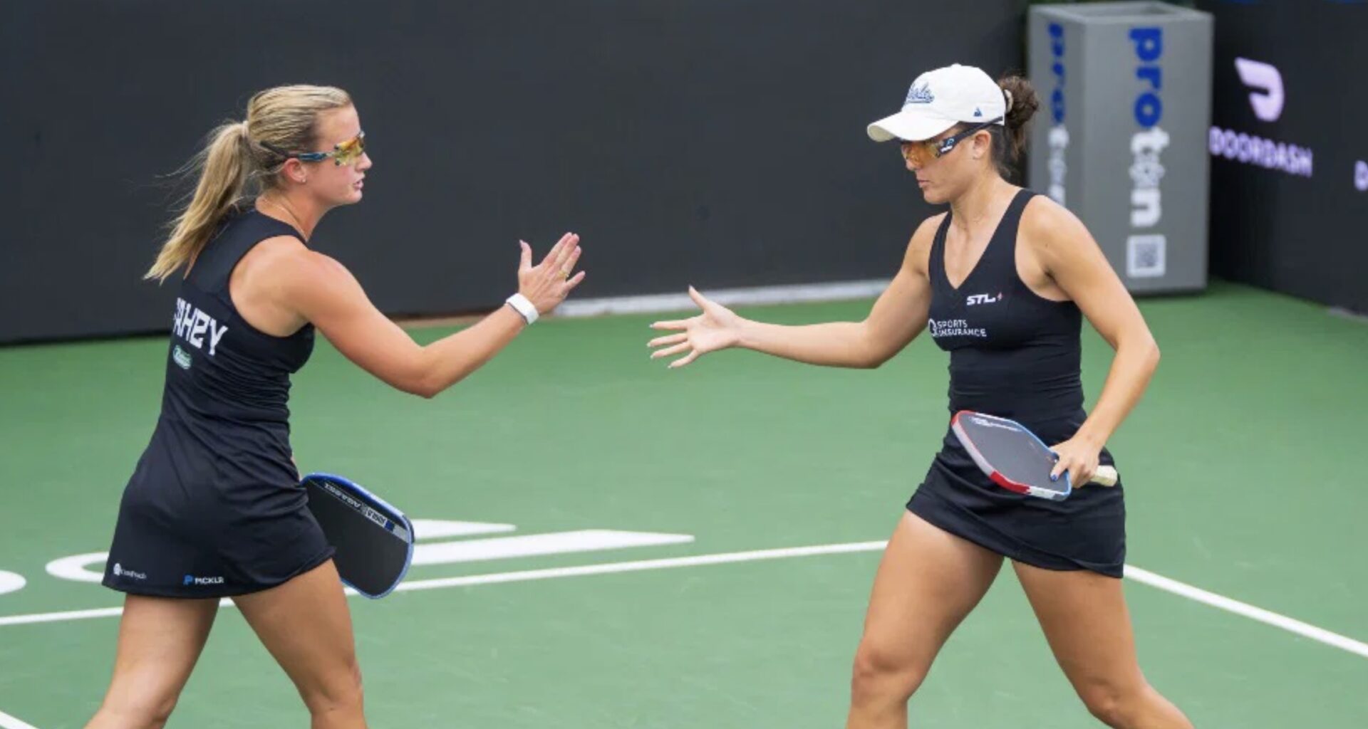 Kate Fahey and Anna Bright celebrate after a point during Major League Pickleball St. Petersburg.