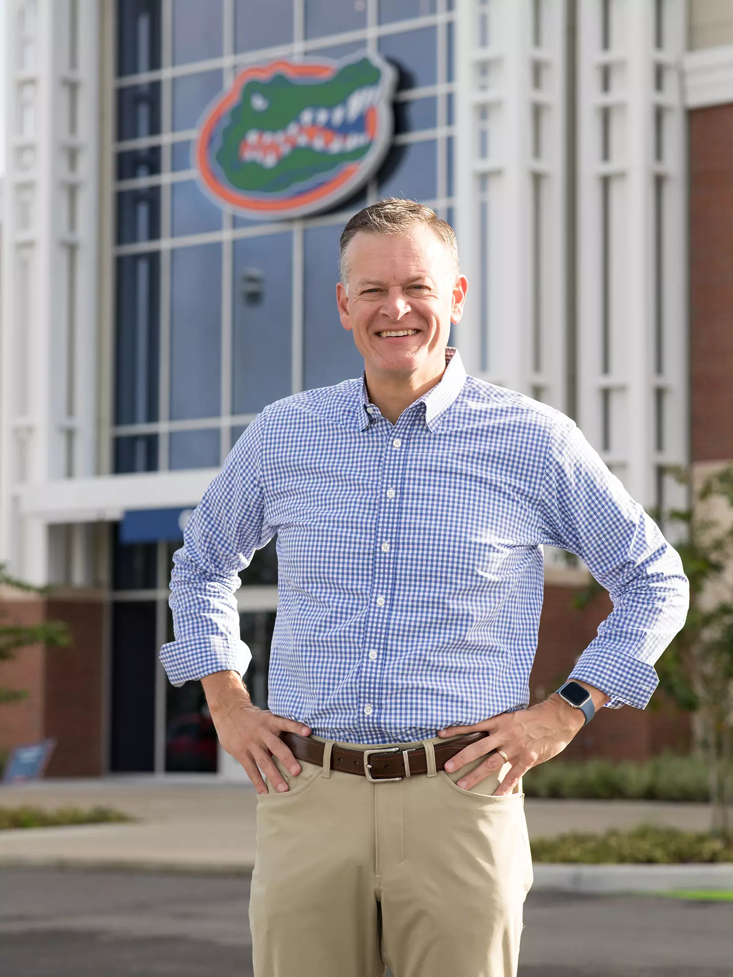 Scott Stricklin, hands on hips, outside stadium