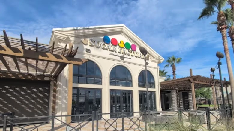 The front entrance of the Sugar Factory at The Markets at Town Center.