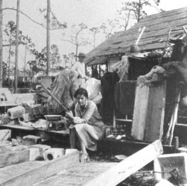 A woman sits amid rubble in Fort Lauderdale after the Great Miami Hurricane of 1926. (Courtesy NOAA)