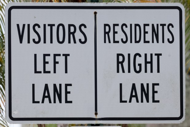 Gated communities often have separate lanes of traffic for visitors and residents. (Mike Stocker/South Florida Sun Sentinel)