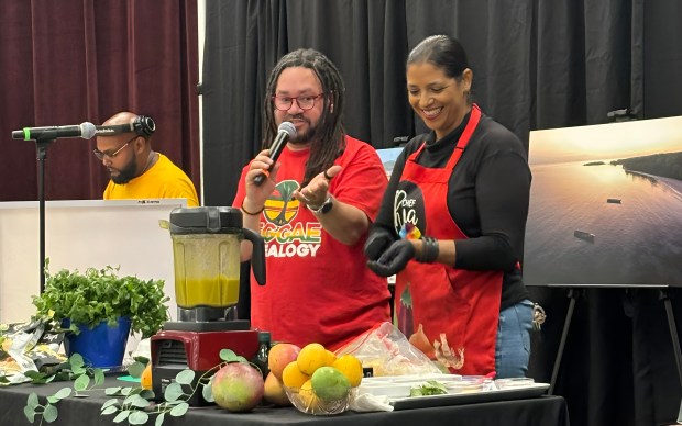 Former Island SPACE Caribbean Museum board president David Muir and Cynthia "Chef Thia" Verna from PBS' "Taste the Islands" at the 2025 Island SPACE Mango Festival in Lauderdale Lakes. This year's festival will be on Father's Day Sunday, June 21 in Pembroke Pines. (Island SPACE Caribbean Museum/Courtesy)