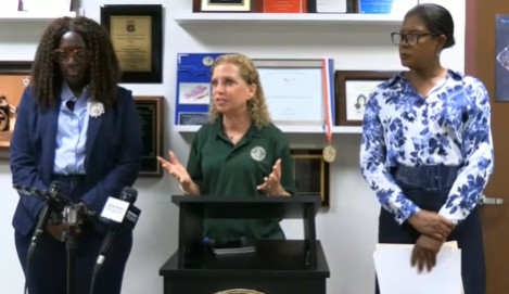 Sandra Cherfrere, left, U.S. Rep. Debbie Wasserman Schultz, center, and Denise Brown discuss the impact of a Supreme Court ruling on temporary protected status at a news conference in Sunrise on Friday, June 26, 2026. (Office of U.S. Rep. Debbie Wasserman Schultz livestream/courtesy)