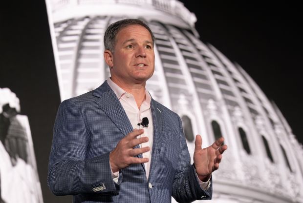 Geoffrey Freeman, president and CEO of the U.S. Travel Association, speaks on stage during a press conference at the U.S. Travel Association's IPW conference at the Broward County Convention Center in Fort Lauderdale. (U.S. Travel Association/Courtesy)