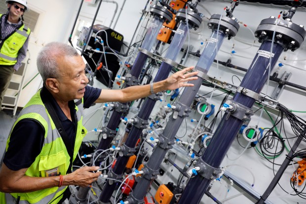 Commissioning engineer Jai Kumar on June 10 shows a test of four types of filtration media inside the PFAS removal system pilot trailer at the Prospect Lake Clean Water Center in Fort Lauderdale. (Amy Beth Bennett/South Florida Sun Sentinel)