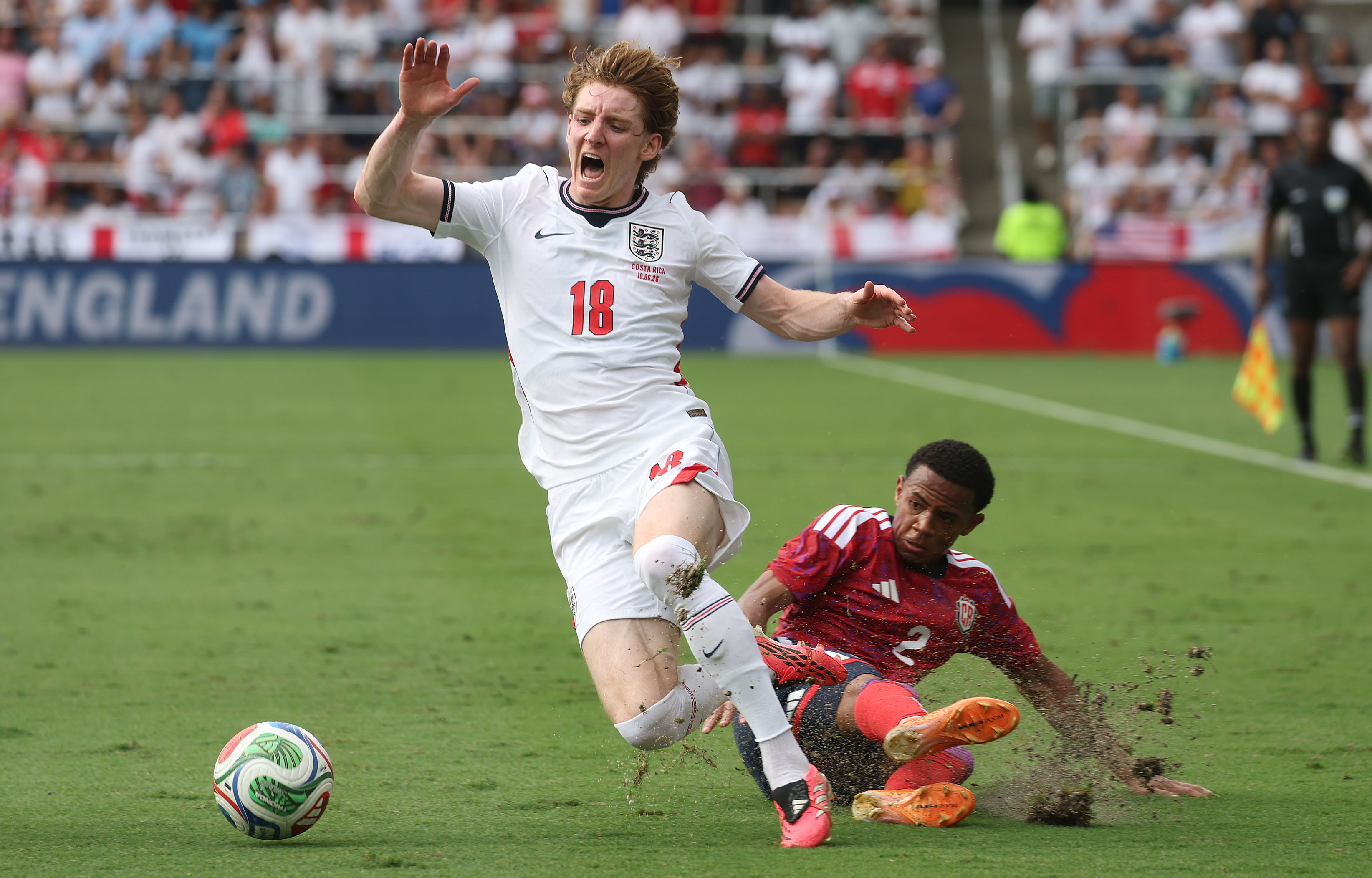 England player Anthony Gordon (18) is fouled by Costa Rica...