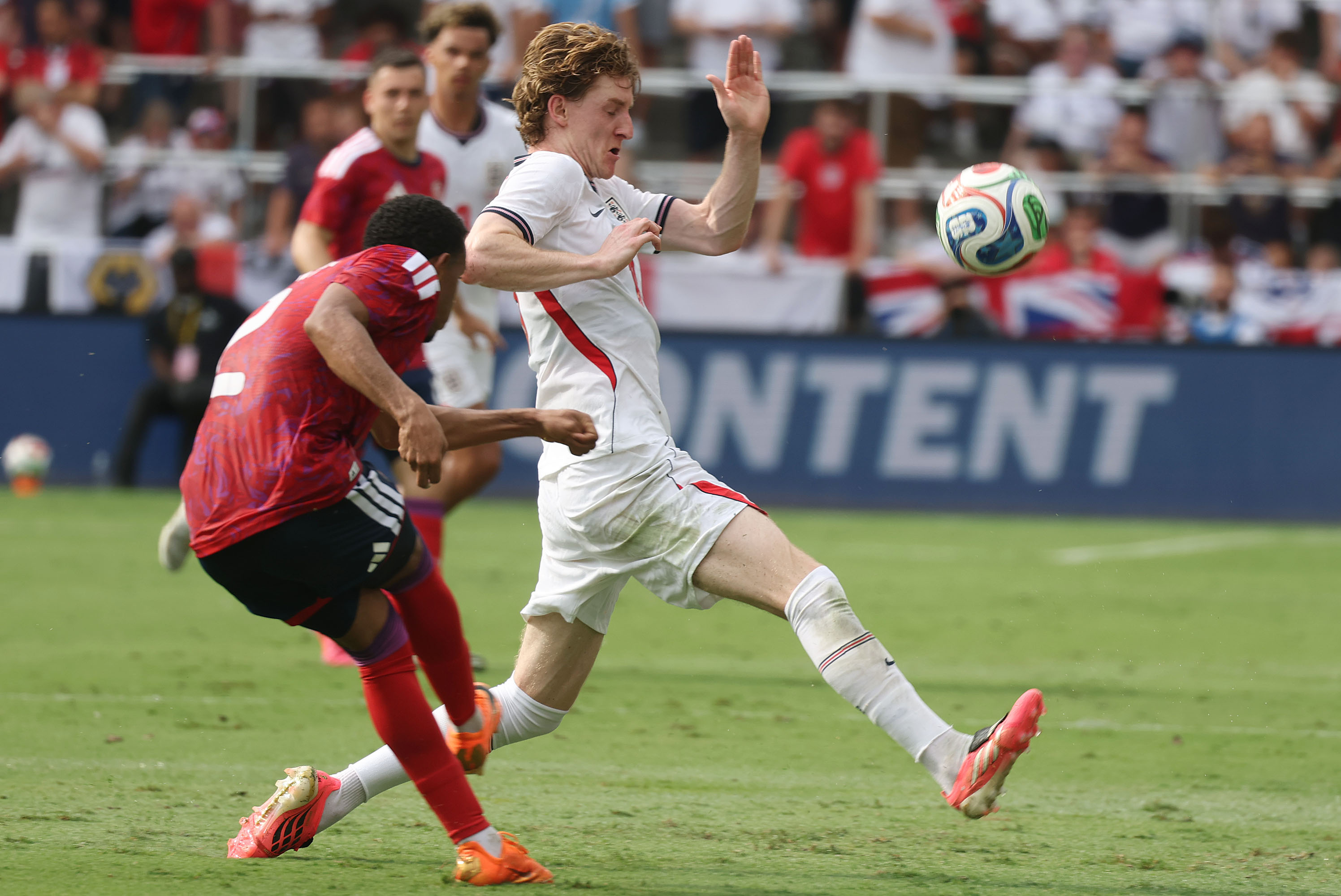 England player Anthony Gordon (right) moves the ball past Costa...