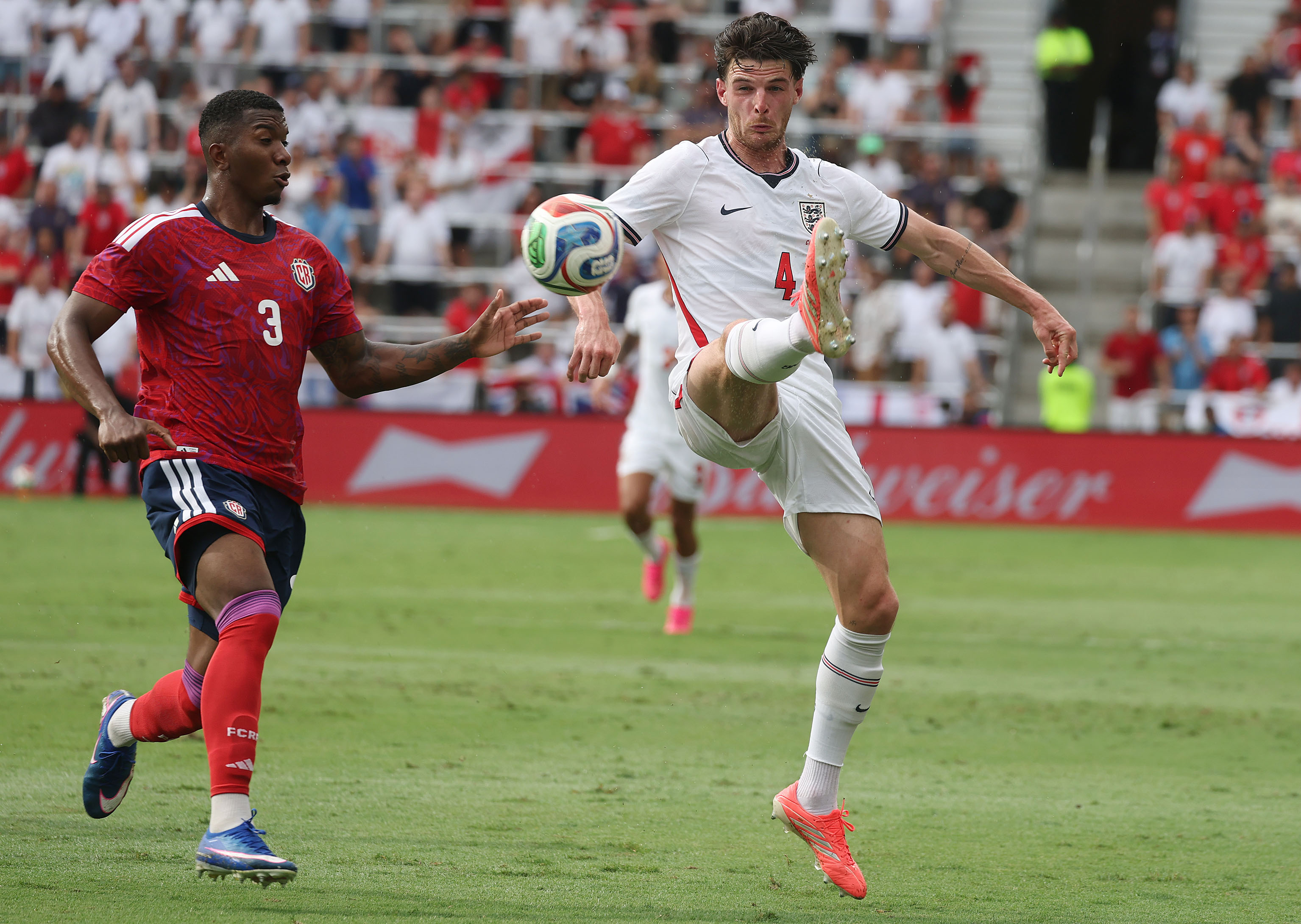 England player Declan Rice (4) controls the ball beside Costa...