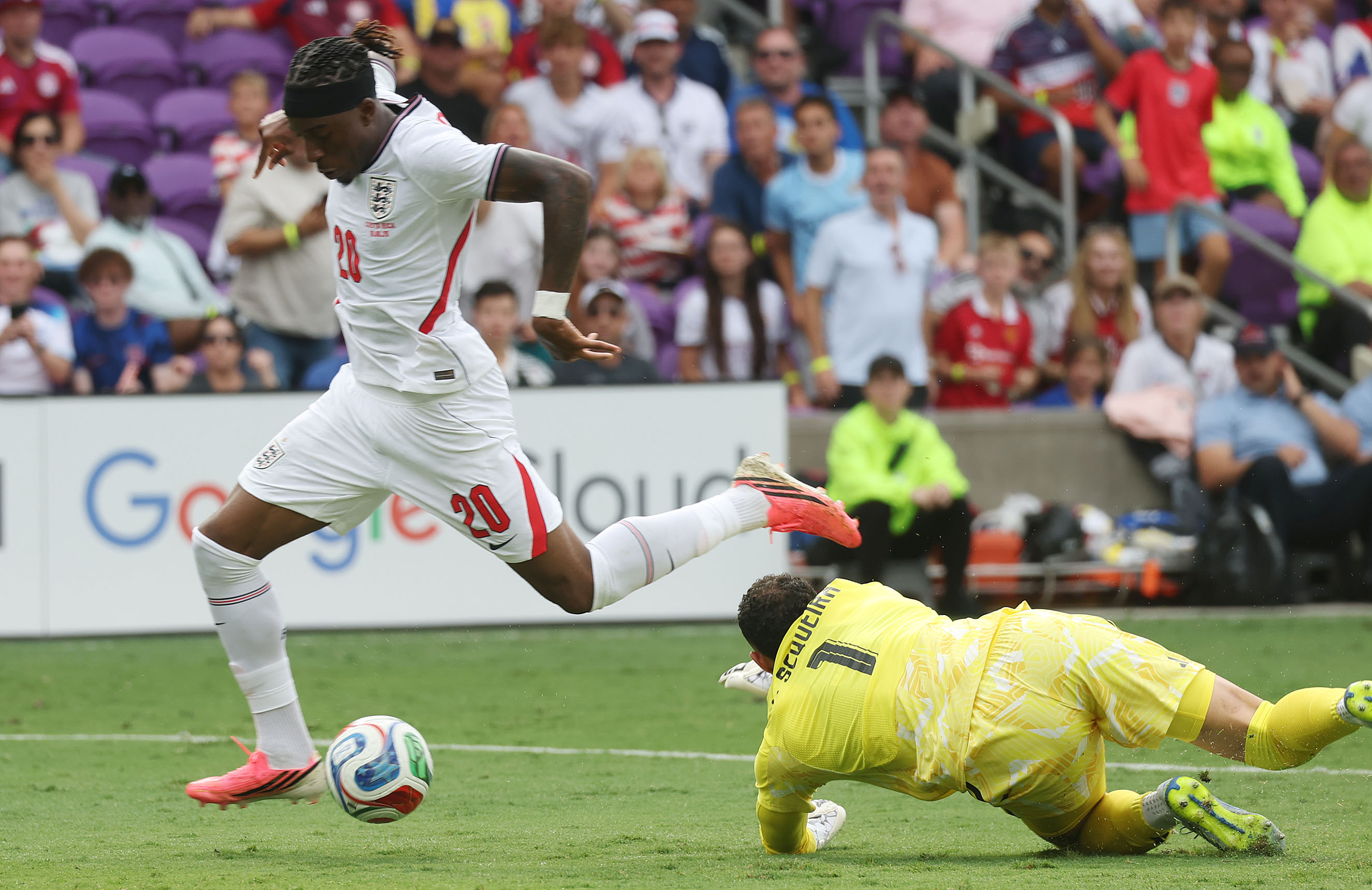 England player Chukwunonso Madueke (20) runs over Costa Rica goalkeeper...