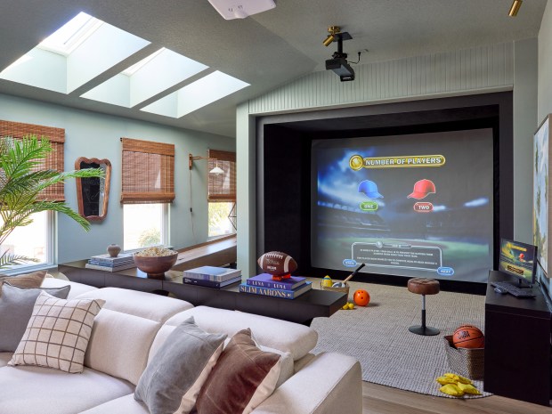 The Kleinschmidts could have added a fourth bedroom, but they opted to expand the upstairs loft, which is the main hangout area and features a sports simulator. (Courtesy of Scripps Networks)
