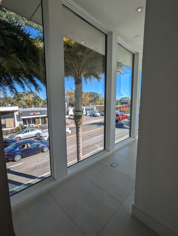 Floor-to-ceiling windows overlook Fairbanks Avenue from the Phil Kean showroom, one of two buildings included in the $3.3 million listing. (Handout from CrossMarc Services)