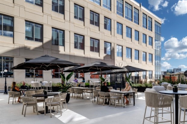 The exterior and side courtyard space of the new global headquarters for Travel + Leisure Co. at 501 W. Church Street in downtown Orlando. (Photo by RiMO Photo)